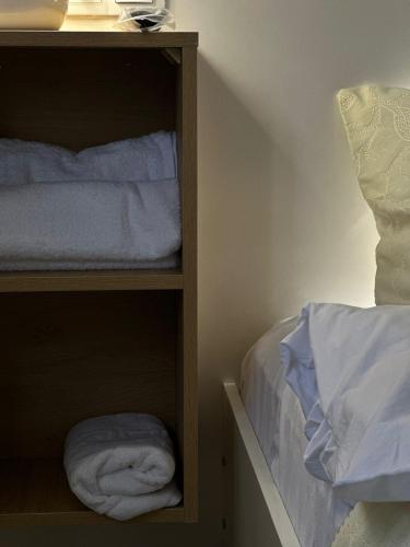 a bedroom with a bunk bed with white towels at LARDA TBILISI in Tbilisi City