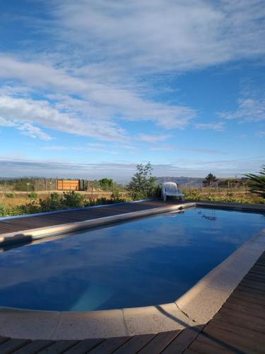 a swimming pool with a view of a field at Casa Vesta Mar in San Antonio