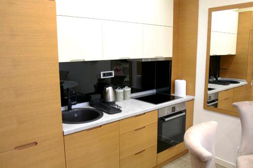 A kitchen or kitchenette at Apartman Bajka