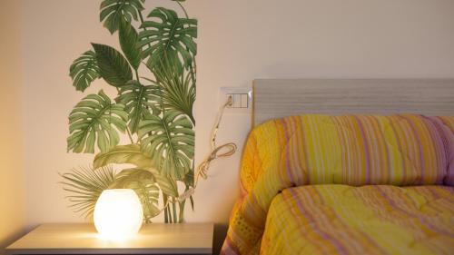 a bedroom with a bed and a lamp on a table at Tenute Donna Franca in Elice