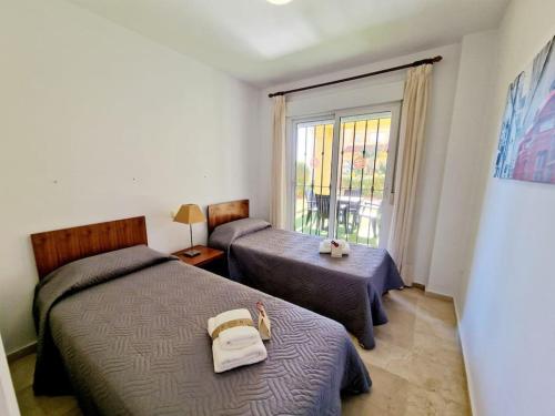 En eller flere senge i et værelse på Ground floor Apt in Atalaya