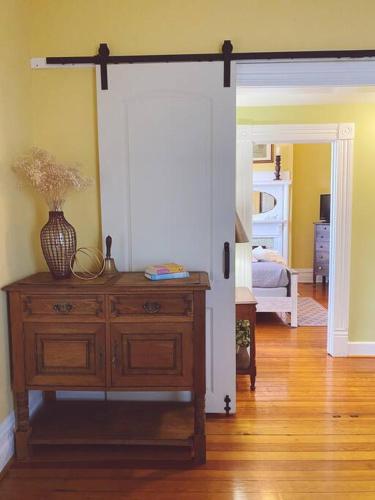 an open door to a room with a vase on a dresser at Kathy's Place - Pet Fee Additional Charge in Lexington