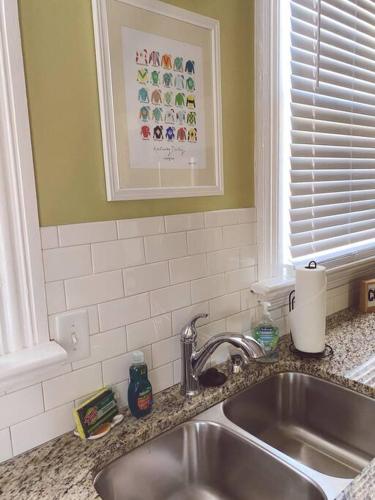 a kitchen counter with a sink and a window at Kathy's Place - Pet Fee Additional Charge in Lexington