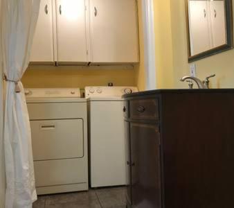 a kitchen with white appliances and a sink at JW's LOFT - Pet Fee Additional Charge in Lexington