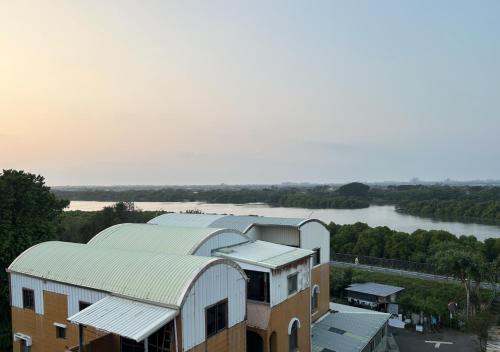 a building with a view of a river at 在海的另一邊 in Anping