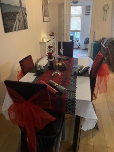 a dining room table with a christmas decoration on it at ChezVous in Swords