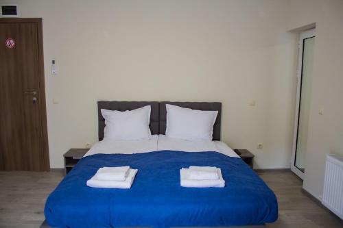 Ένα ή περισσότερα κρεβάτια σε δωμάτιο στο Guesthouse The Rock