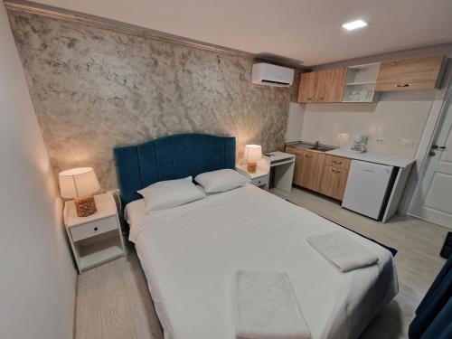 Кровать или кровати в номере Alex Residence