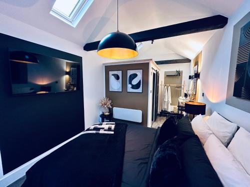 a living room with a couch and a lamp at Luxury self-contained suite. in Cardiff