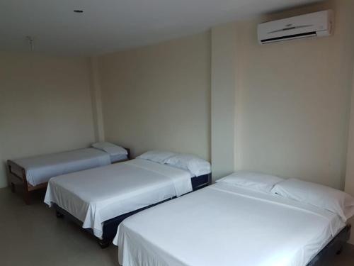 Ein Bett oder Betten in einem Zimmer der Unterkunft El Sol Dorado