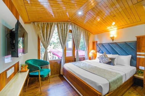 a bedroom with a bed and a chair in a room at Singhs BnB by Lazy Getaways in Shimla