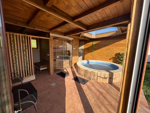 a bathroom with a jacuzzi tub on a patio at El BURGO DE OSMA ALOJAMIENTO RURAL VILLA BAGH in El Burgo de Osma