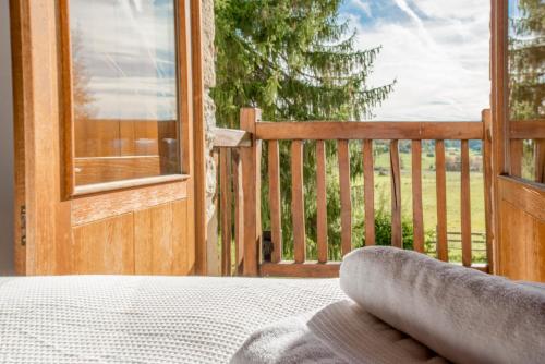 a view of a porch with a bed and a window at Egur Etxe I Caserío Vasco I Jardín I Porche I BBQ I Chimenea in Zárate