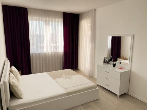 Кровать или кровати в номере City Center Apartment