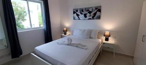 מיטה או מיטות בחדר ב-Tamarindo Dominicus by Mireya