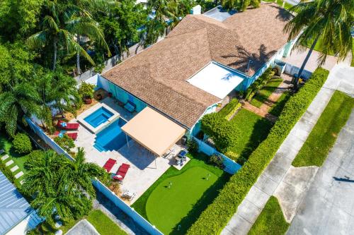 an overhead view of a house with a swimming pool at Walk to The Ave- Heated Pool, Spa, Golden Tee and Putting Green - mins to Beach in Delray Beach