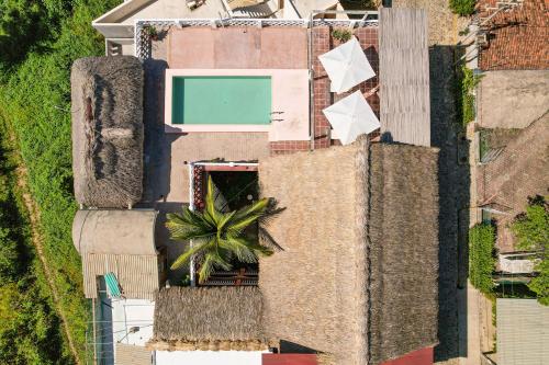 an overhead view of a building with a pool at Hotel Flor de Maria in Puerto Escondido