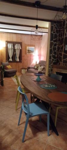 a room with a table and chairs and a couch at Baita Tre Querce in Viggiano