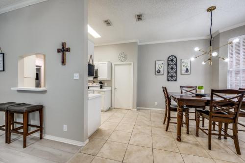 a kitchen and dining room with a table and chairs at Spacious Brick House 3BR 2BA A+ in Denton