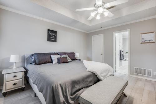a bedroom with a bed and a ceiling fan at Spacious Brick House 3BR 2BA A+ in Denton