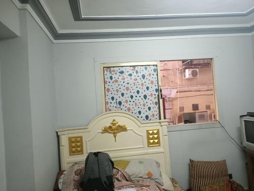 เตียงในห้องที่ studio in king Faisal street madkor station road