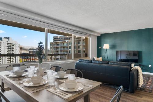 a living room with a table and a couch at UrbanDelight Crystal City Mins to DC Free Parking in Arlington