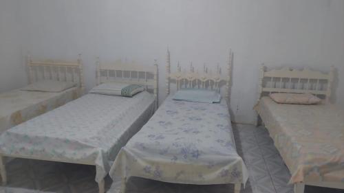 Un ou plusieurs lits dans un hébergement de l'établissement Casa DiTania Jatobá SE