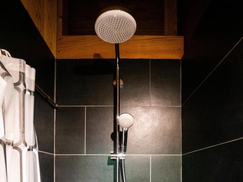 a shower with two lights in a bathroom at Alpages - Vacation STAY 11099 in Myoko