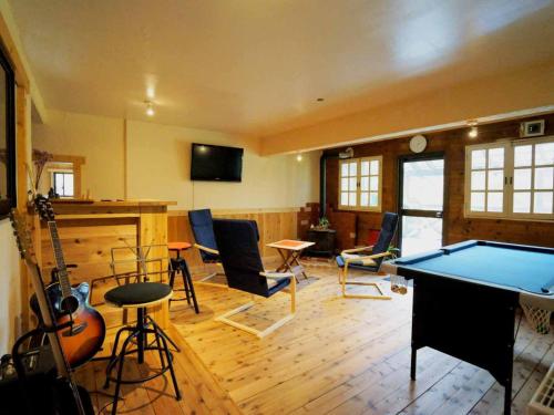 a room with a ping pong table and a pool table at Alpages - Vacation STAY 13707 in Myoko