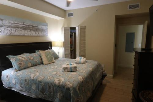 a bedroom with a bed with two boxes on it at AQUA 1504 Beachfront condo with Free Beach Chairs in Panama City Beach