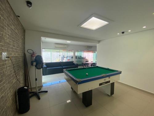 a living room with a pool table in it at Conexão 021 in Boa Vista