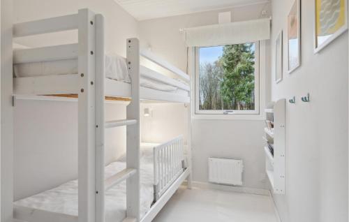 a white room with bunk beds and a window at Gorgeous Home In Fårvang With Wifi in Fårvang