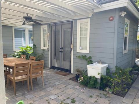 a house with a table and a sink on a patio at Casita in Ladera Ranch
