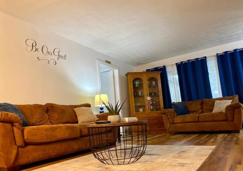 a living room with a couch and a table at Notre Dame vs USC, 5 BR Ranch Walk to Campus, 2 Full Baths, Game Room in South Bend