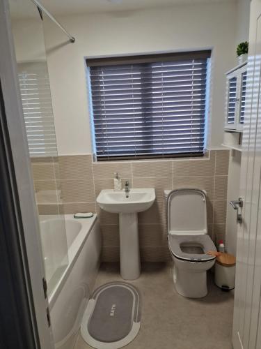 a bathroom with a sink and a toilet and a sinkiterator at The place of peace in Saint Helens