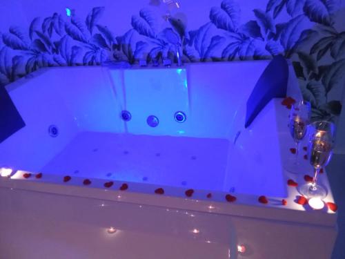 a bathtub in a room with a blue ceiling at Maison De luxe in Pompei