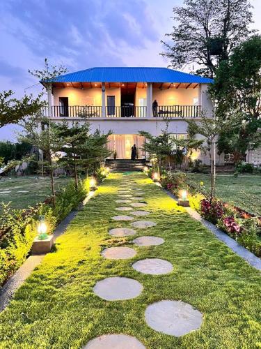 a pathway in front of a house with a building at Jewel Stay in Tāla