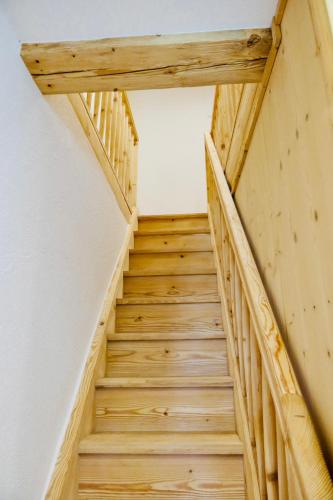 a wooden staircase leading up to a room at Apart Chalet Unterbrandnerlehen in Schönau am Königssee