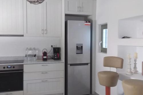 Η κουζίνα ή μικρή κουζίνα στο DREAM VILLAS PAROS 2, ολόκληρος χώρος με πισίνα