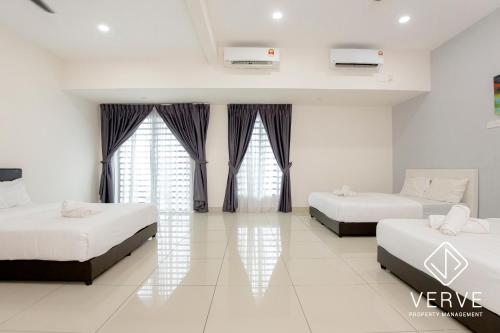 a bedroom with two beds and two windows at Ipoh Luxury Suites by Verve (18 Pax) EECH16 in Ipoh