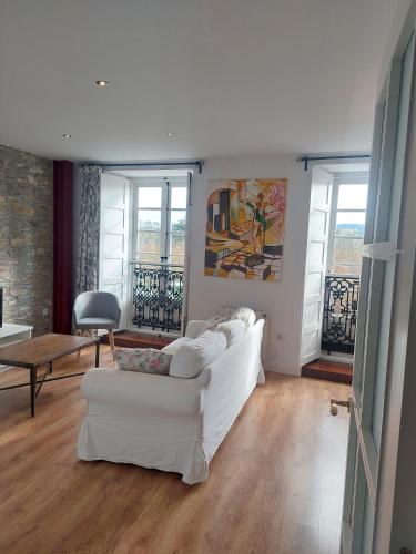 a living room with a white couch and a table at SAN FRANCISCO in Ribadeo