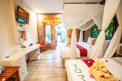 a hotel room with two beds and a kitchen at Kubuku Eco Dive Lodge and Yoga in Pemuteran