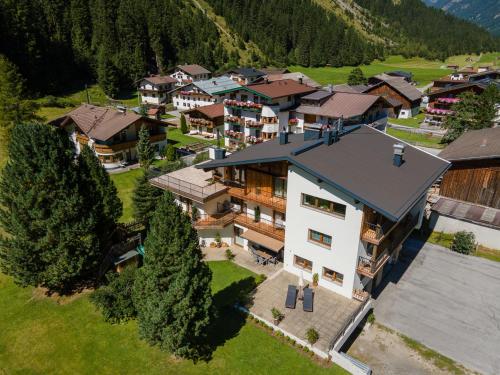 an aerial view of a house in a mountain at Gletscher-Landhaus Brunnenkogel in Sankt Leonhard im Pitztal