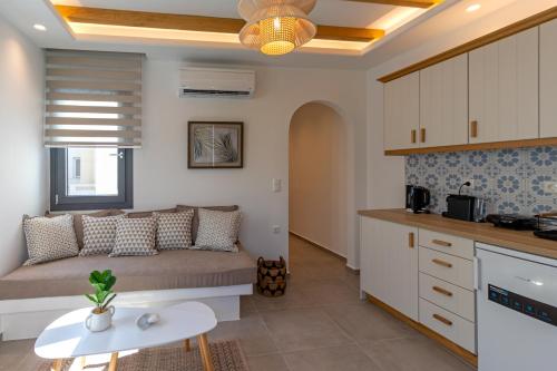 a living room with a couch and a table at Juliano luxury apartments, port of Naxos in Naxos Chora