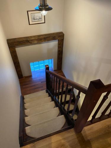 a staircase in a house with a stair case at zielonapogoda in Lądek-Zdrój