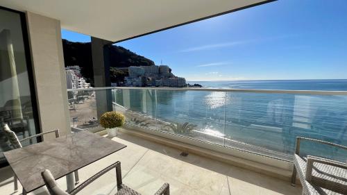 a balcony with a view of the ocean at Sunraf Luxe Apartments in Budva