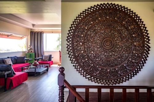 a large wall art in a living room at Koh Mak Penthouse in Ko Mak