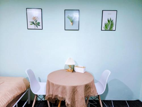 a room with a table and two beds at 814-STP Homely room Free Wi-Fi and Near BTS line in Bangkok