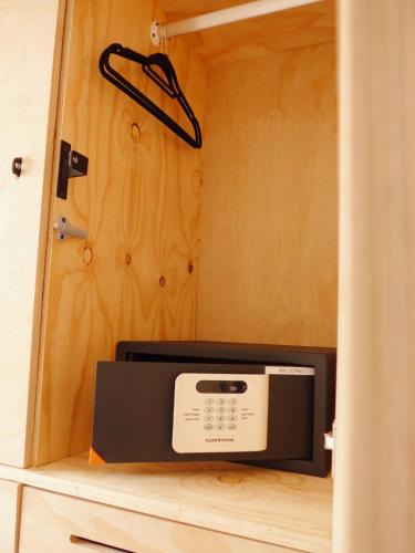a microwave sitting on top of a shelf in a room at Villa Viva Cape Town in Cape Town