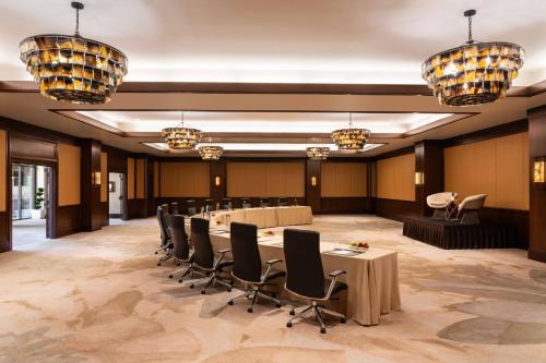 a conference room with a long table and chairs at The Ritz-Carlton, Rancho Mirage in Rancho Mirage